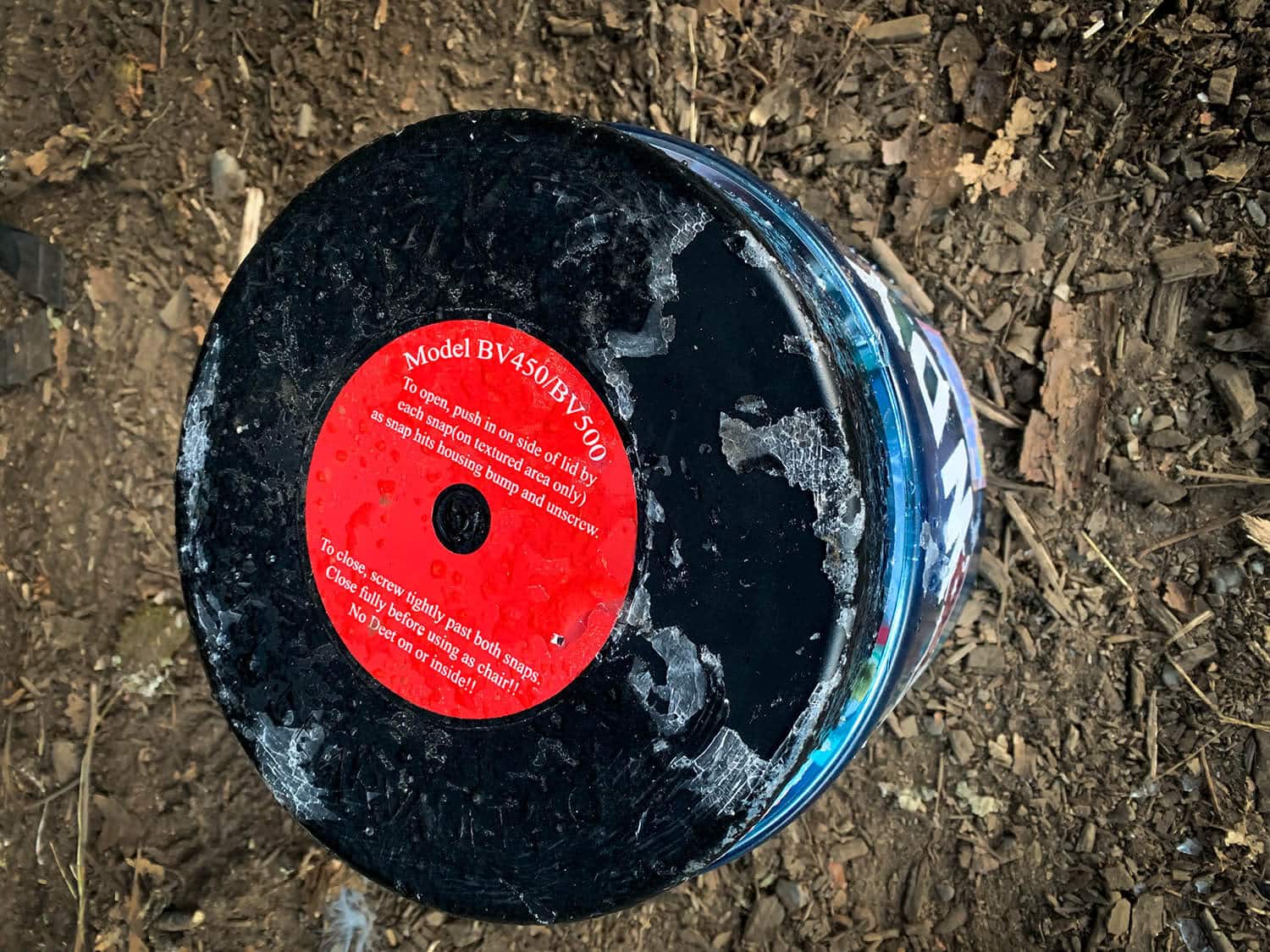 BearVault bear canister with ice formed on lid