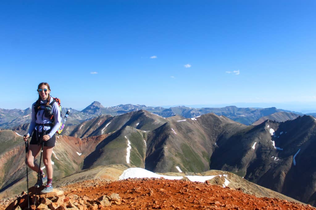Hiker at the top of Red Cloud Peak.