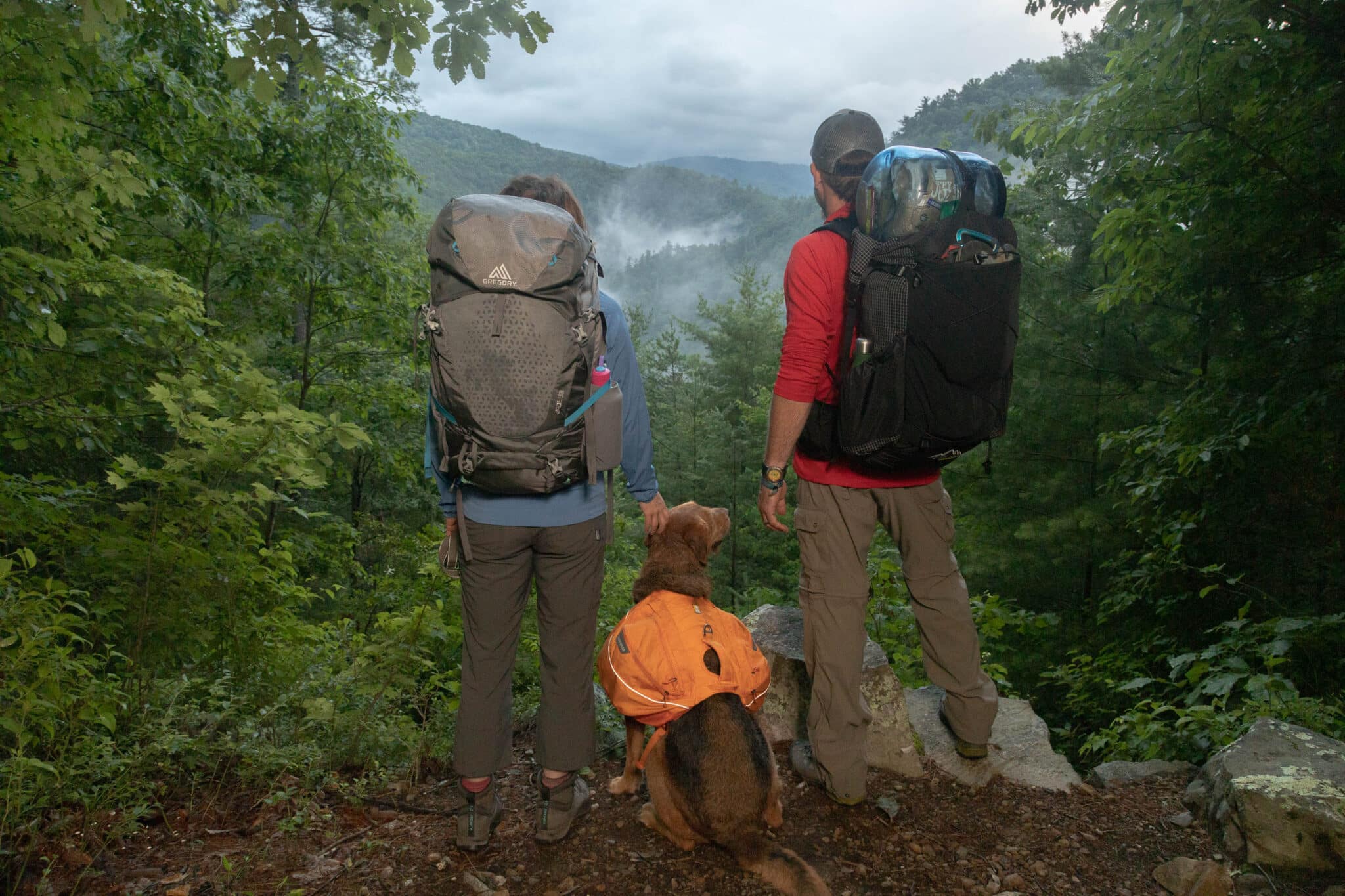 Hikers look over a rainy valley in GSMNP.